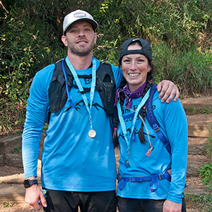 5-person team in matching shirts at the top of Pikes Peak