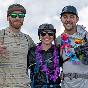 Hiker at the summit of Pikes Peak with a "hang loose" hand signal